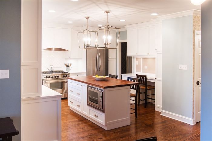 Remodeled kitchen with center island and built in desk