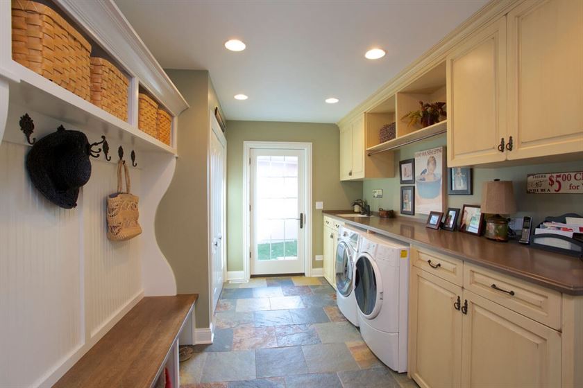 Mudroom and laundry room renovation with colorful tile flooring