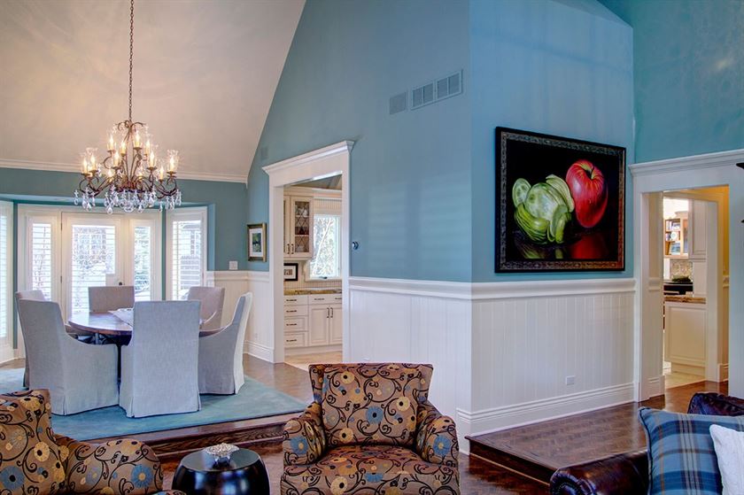 open concept living and dining room with blue and white walls