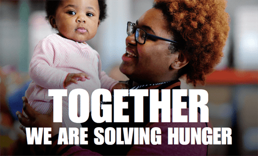 Parent holding child with the words together we are solving hunger 