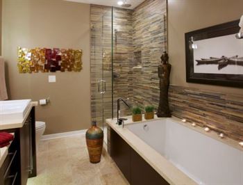Spa bathroom in brown tones with separate bath and shower