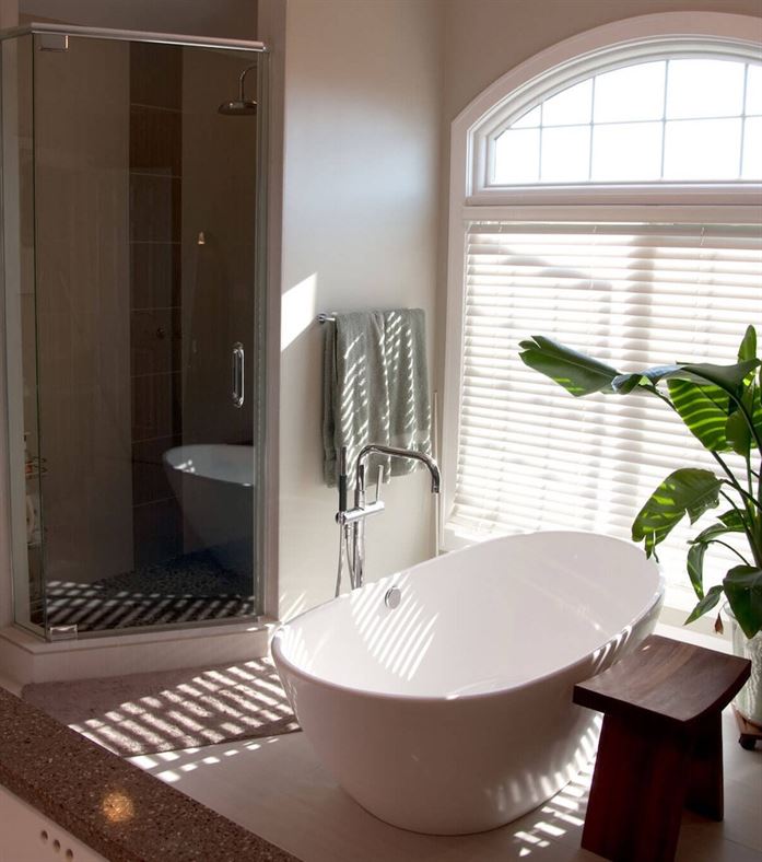 Spa bathroom with deep stand-alone tub and separate shower