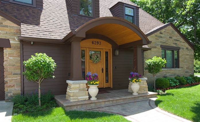 Front door of home with arched dormer