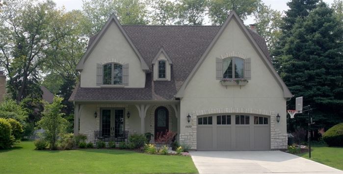 Front of home with gray roof and great curb appeal