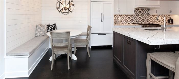 Renovated kitchen with island seating and banquet seating