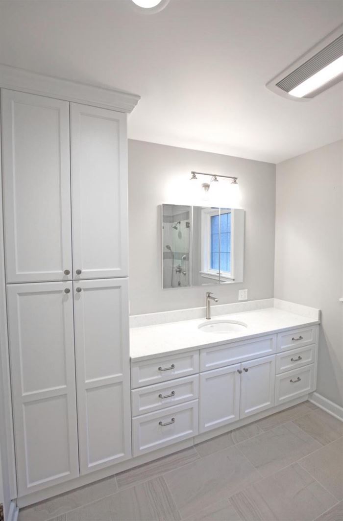 Renovated bathroom with floor to ceiling storage