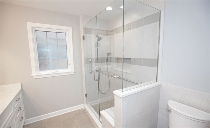 Bathroom with walk-in shower and framleess shower doors