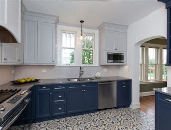 Completed kitchen remodel with blue lower cabinets and white upper cabinets