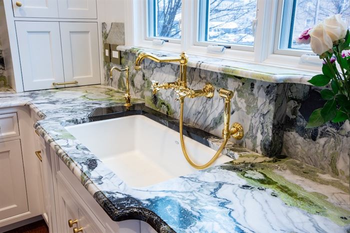 Renovated Forest Park kitchen sink with gold fixtures