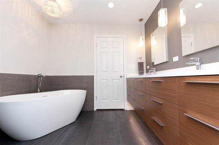 Soaker tub in bathroom with double vanity