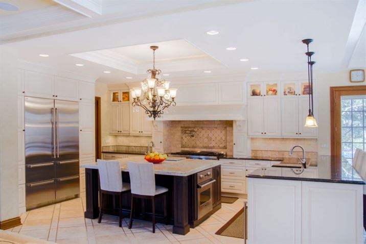 large kitchen with island and breakfast bar