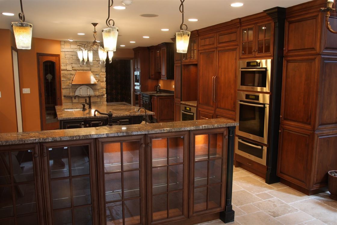 traditional dark wood kitchen with integrated applicances